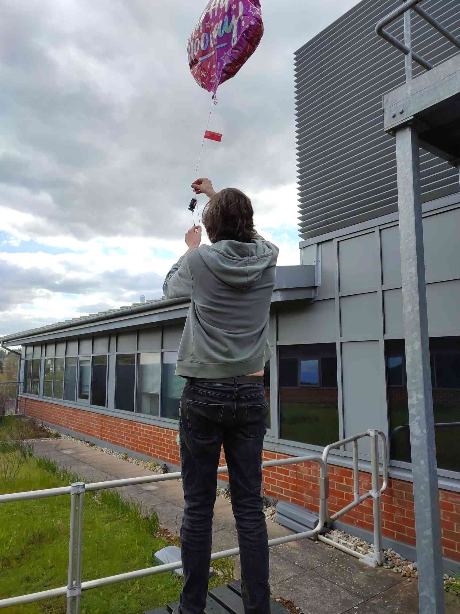 Isaac launching balloon